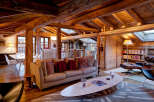 This stunning property boasts a rustic charm with its exposed wooden beams and cozy interior.