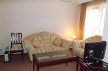 Cozy living room featuring a comfortable sofa and chair, perfect for relaxing after a long day.