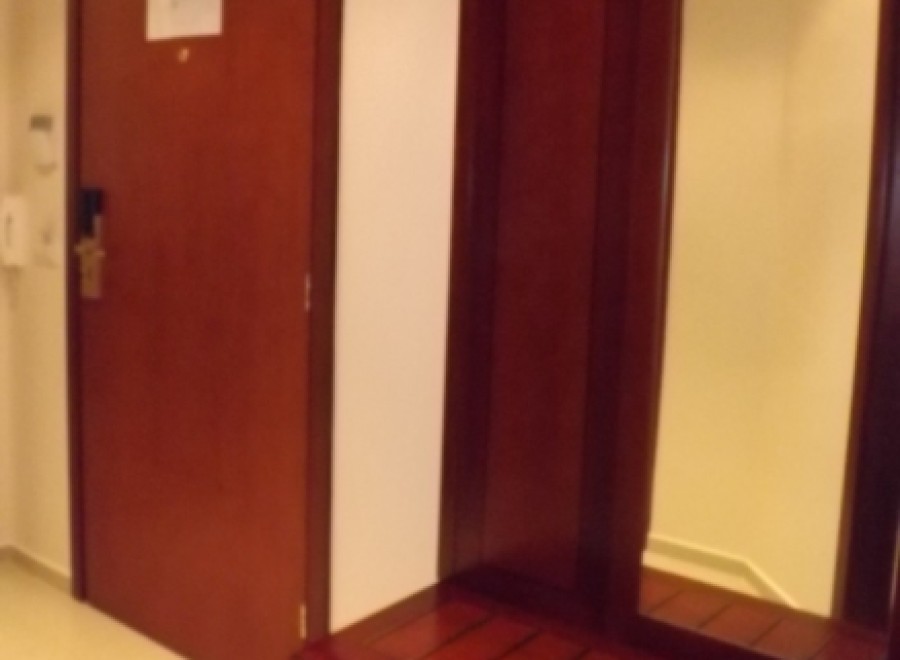 This stunning property boasts a spacious entryway with a built-in wooden bench and mirror, perfect for organizing your belongings and adding a touch of elegance to your home.