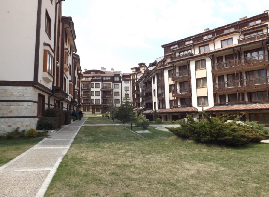 Discover luxurious apartments nestled in a scenic resort setting.