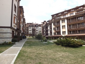 Discover luxurious apartments nestled in a scenic resort setting.