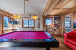 This stunning property boasts a luxurious game room, perfect for entertaining guests.