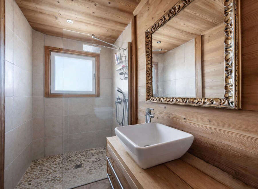 Step into a beautifully designed bathroom featuring natural wood accents and a modern aesthetic.