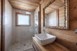 Step into a beautifully designed bathroom featuring natural wood accents and a modern aesthetic.