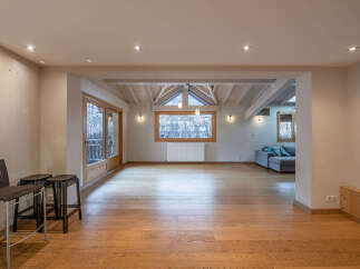 This stunning property boasts a spacious open-plan living area with beautiful wooden flooring throughout.