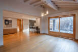 Step into this stunning property featuring a spacious, light-filled living area with beautiful wooden floors.