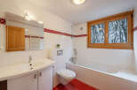 This charming bathroom features a bright and airy design, perfect for relaxation.
