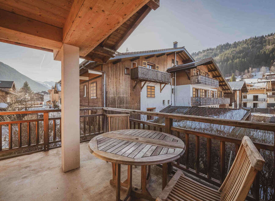 Enjoy breathtaking mountain views from this charming balcony.