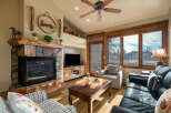 Step into this inviting living space, featuring a cozy fireplace and a stylish entertainment center.