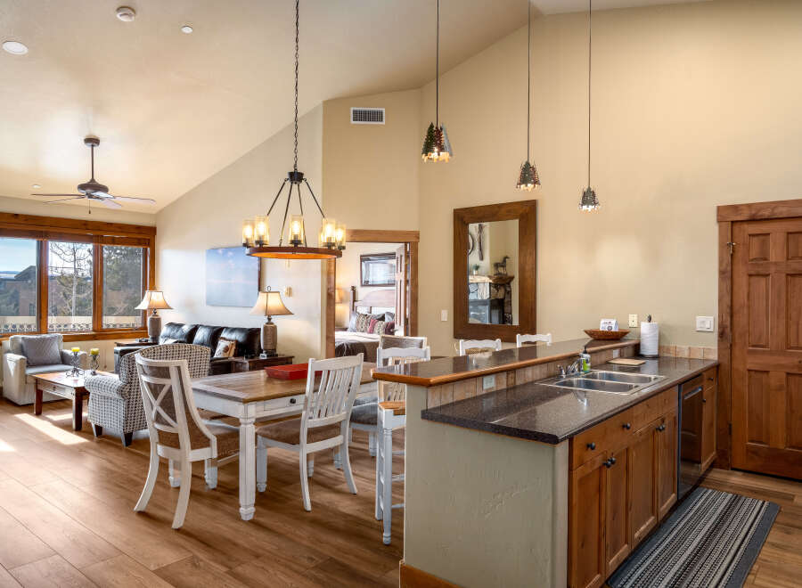 This stunning property features a spacious open-concept living area with a modern kitchen and dining space.