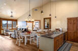 This stunning property features a spacious open-concept living area with a modern kitchen and dining space.