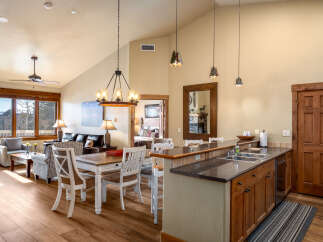This stunning property features a spacious open-concept living area with a modern kitchen and dining space.