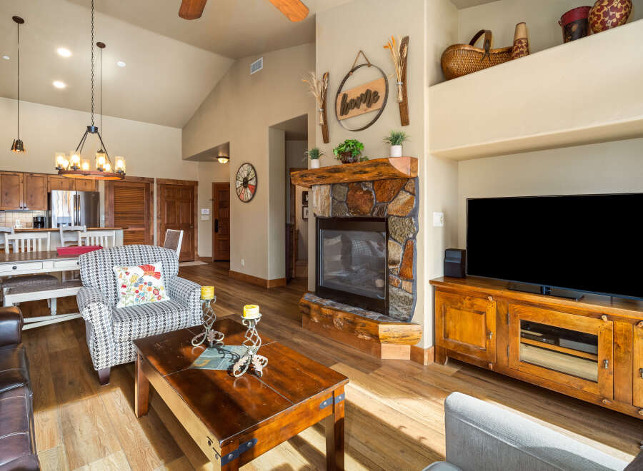 This stunning living room boasts a cozy fireplace, perfect for chilly evenings.