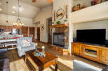 This stunning living room boasts a cozy fireplace, perfect for chilly evenings.