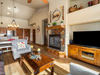 This stunning living room boasts a cozy fireplace, perfect for chilly evenings.