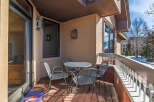 Enjoy the fresh mountain air from this charming balcony! This outdoor space features a cozy table and chairs, perfect for morning coffee or evening relaxation.