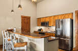 This stunning kitchen boasts a modern design with a touch of rustic charm.