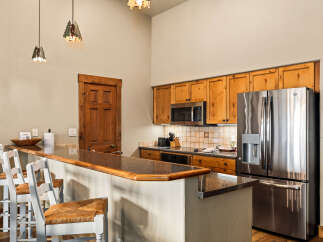 This stunning kitchen boasts a modern design with a touch of rustic charm.