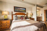 This inviting bedroom showcases a blend of rustic charm and modern comfort.