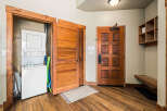 Step into this inviting entryway featuring a stacked washer and dryer, perfect for convenient laundry days.