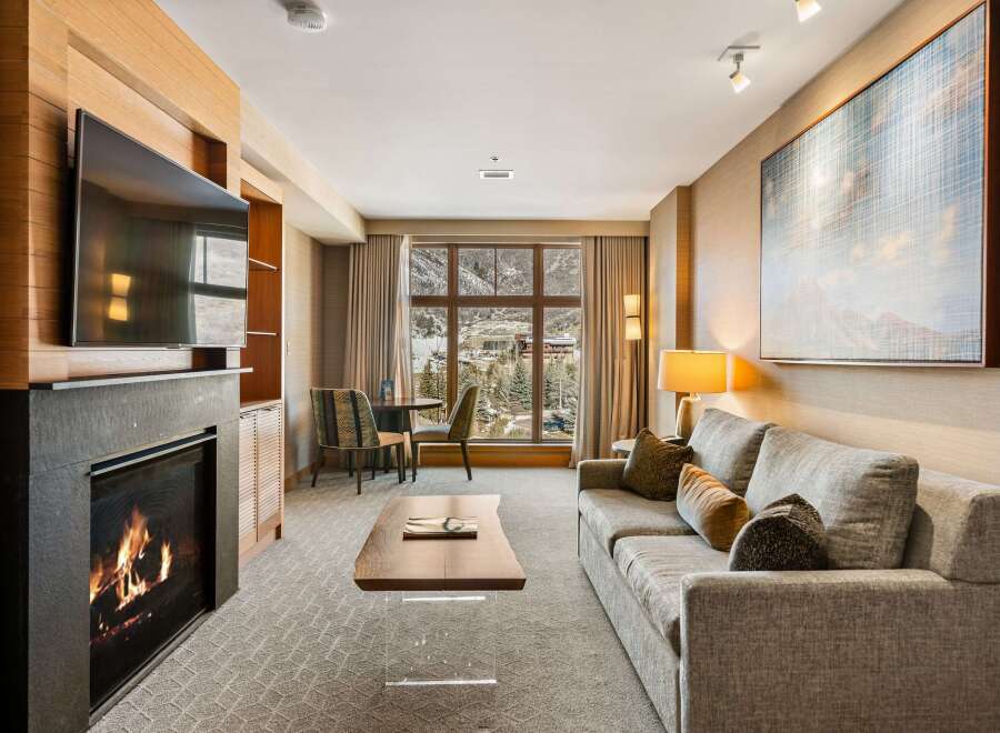 Experience luxury living in this stunning property featuring a cozy fireplace, perfect for chilly evenings.