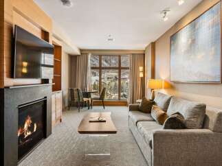 Experience luxury living in this stunning property featuring a cozy fireplace, perfect for chilly evenings.