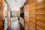 Step into luxury with this stunning property featuring exquisite wooden accents and a modern design.