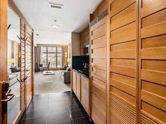 Step into luxury with this stunning property featuring exquisite wooden accents and a modern design.