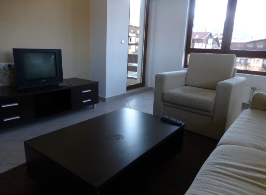 Cozy living room with a comfortable armchair and sofa, perfect for relaxing after a day of exploring.