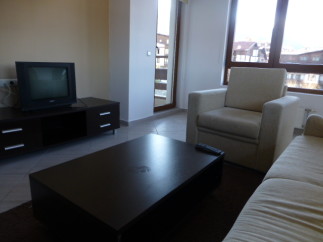 Cozy living room with a comfortable armchair and sofa, perfect for relaxing after a day of exploring.