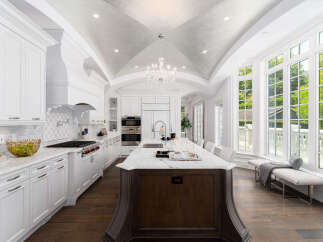 This stunning kitchen boasts a luxurious design with high-end finishes.