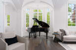 Experience luxury living in this stunning property featuring a grand piano, perfect for music enthusiasts.