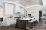 Experience luxury living in this stunning kitchen! Featuring a spacious island with seating, high-end appliances, and elegant white cabinetry, this kitchen is perfect for both cooking and entertaining.
