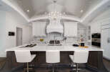This stunning kitchen boasts a luxurious design with a large island, perfect for both cooking and entertaining.