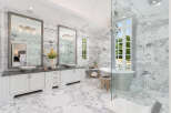 Step into luxury with this stunning bathroom featuring exquisite marble finishes and elegant design.