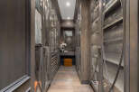 Step into luxury with this stunning walk-in closet, designed with meticulous attention to detail.