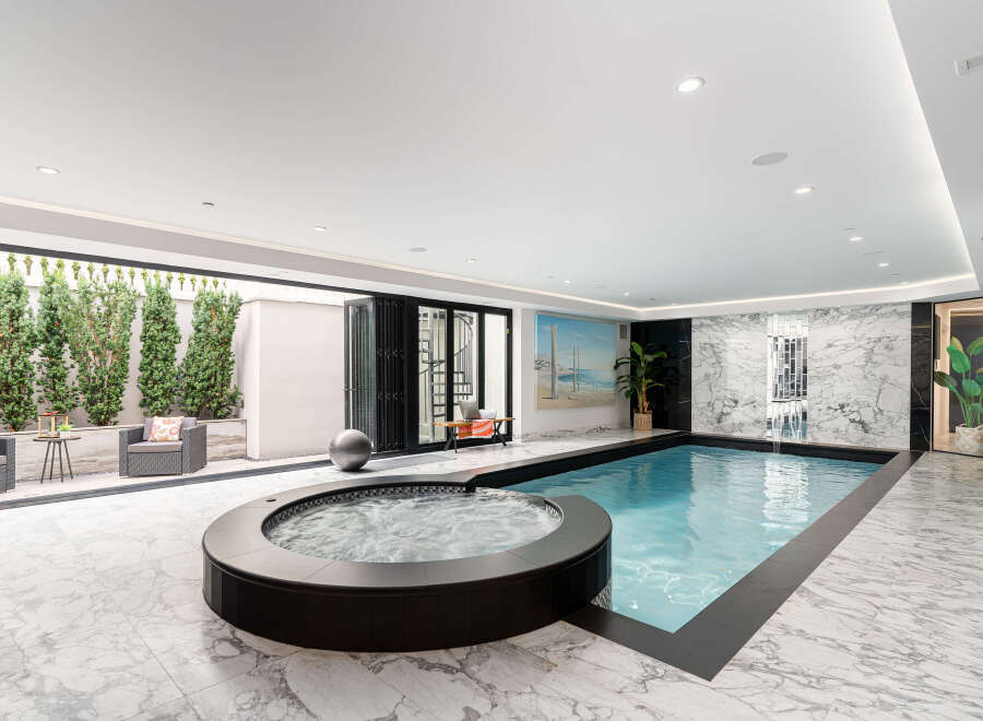Experience luxury living with this stunning indoor pool and spa.