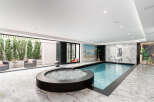 Experience luxury living with this stunning indoor pool and spa.