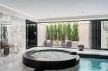 Indulge in luxury with this stunning indoor spa retreat.