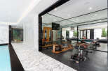 This luxurious property boasts a state-of-the-art home gym, perfect for maintaining a healthy lifestyle.