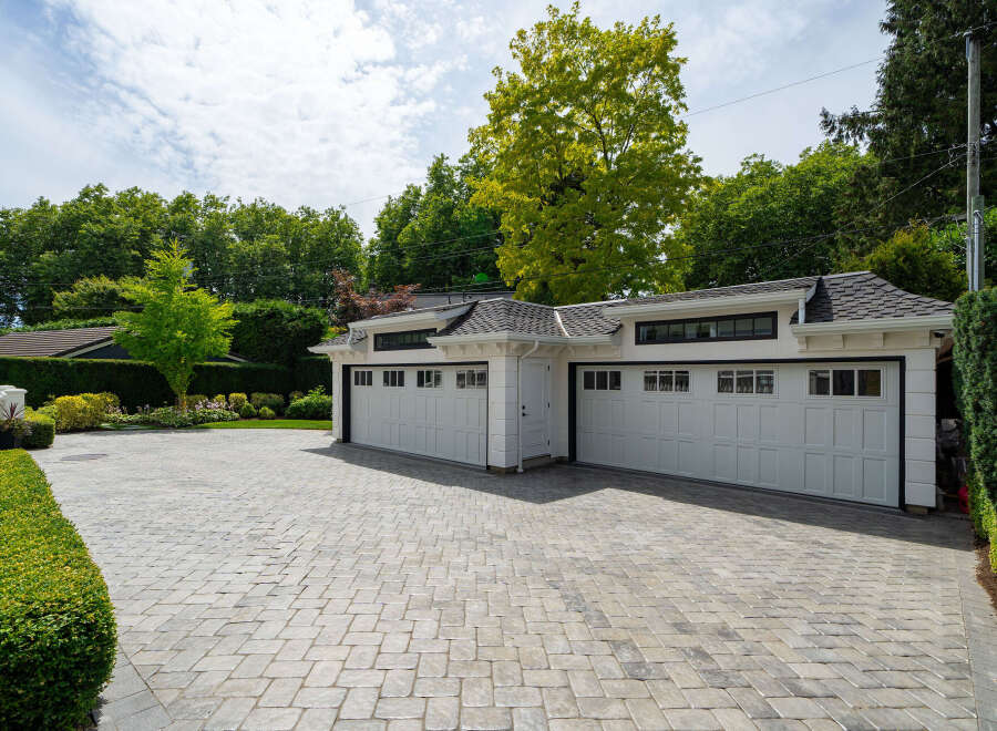 This stunning property boasts a beautifully designed garage with ample space for vehicles and storage.