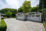 This stunning property boasts a beautifully designed garage with ample space for vehicles and storage.