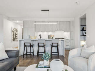 Experience modern living in this stunning kitchen! Featuring sleek cabinetry, a stylish breakfast bar, and high-end appliances, this space is perfect for both cooking and entertaining.