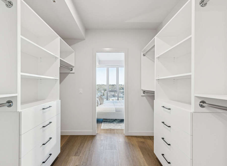 Step into luxury with this stunning walk-in closet, offering ample storage and organization.