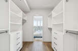 Step into luxury with this stunning walk-in closet, offering ample storage and organization.