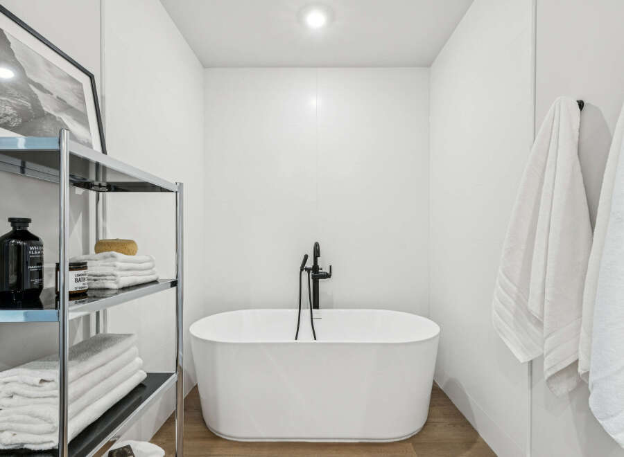 Step into a serene bathroom oasis, featuring a luxurious soaking tub and modern fixtures.