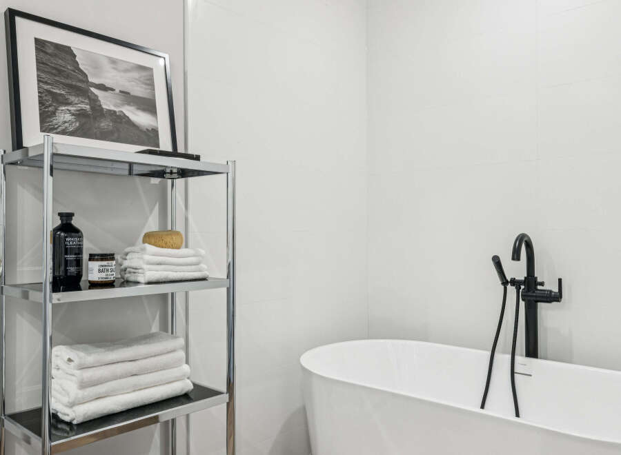This modern bathroom features a sleek, minimalist design with clean lines and a bright, airy feel.