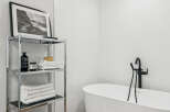 This modern bathroom features a sleek, minimalist design with clean lines and a bright, airy feel.