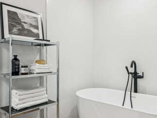 This modern bathroom features a sleek, minimalist design with clean lines and a bright, airy feel.