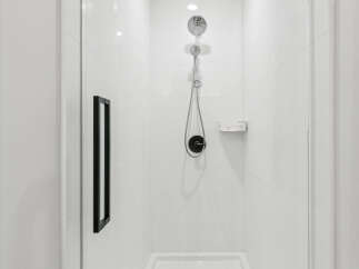 Step into a modern oasis with this sleek shower.